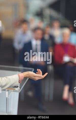 Female speaker speaks in a business seminar Stock Photo