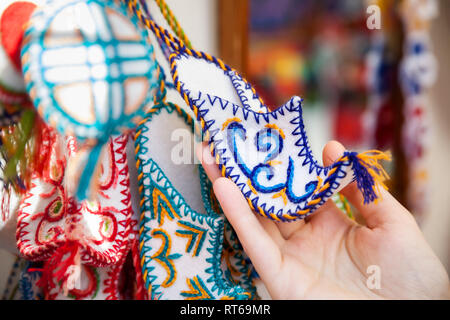 Ethnic oriental felt toy of the shoe at Asian market Stock Photo