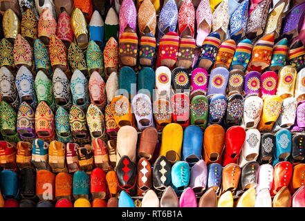 Brightly colored, handmade Moroccan slippers on display in  Fez, Morocco. Stock Photo