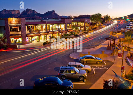 Uptown Sedona Arizona at dusk with cars tail lights trailing Stock Photo