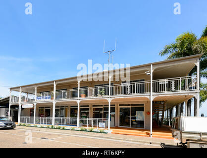 Shops in an old building with rought-iron balcony along the foreshore, Cooktown, Far North Queensland, QLD, FNQ, Australia Stock Photo