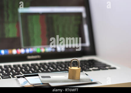 internet security concept, with credit card atm and padlock on laptop keyboard, online security transaction Stock Photo