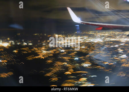 A view from 10,000 feet looking out the window of an airplane. Stock Photo
