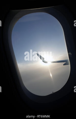 A view from 10,000 feet looking out the window of an airplane. Stock Photo