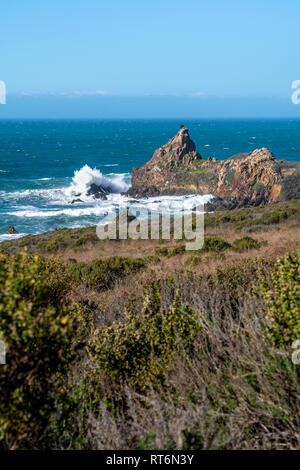 Waves crash onshore along the Highway One and California's Big Sur coastline. Stock Photo