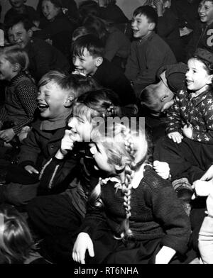 Original caption: 'Sweeney Steps Out.' Sweeney is the star of one of the many instructive and entertaining movie shorts the Linz, Upper Austria American House lends to volunteer operators who display them at rural schools and social centers. Stock Photo