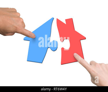 Woman and man two hands assembling house shape puzzles of different color red and blue, high angle view, isolated on white. Stock Photo