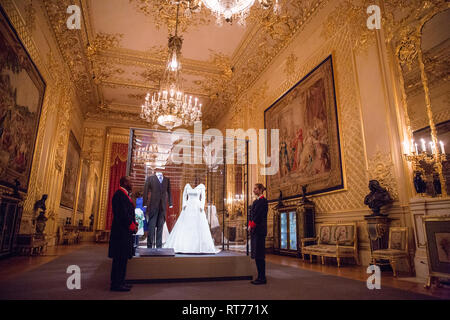 Windsor, UK. 28th Feb, 2019. HRH Princess Eugenie's wedding dress, created by Peter Pilotto and Christopher De Vos of the British-based label Peter Pilotto, and Mr Jack Brooksbank’s morning suit made by tailors at Huntsman on Savile Row, which go on display with other items from their wedding outfits at Windsor Castle  from 1st March to 22nd April. Other items  include the Greville Emerald Kokoshnik Tiara and two diamond wheat-ear brooches. Credit: Mark Kerrison/Alamy Live News Stock Photo