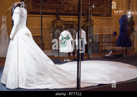 Windsor, UK. 28th Feb, 2019. HRH Princess Eugenie's wedding dress, created by Peter Pilotto and Christopher De Vos of the British-based label Peter Pilotto, and Mr Jack Brooksbank’s morning suit made by tailors at Huntsman on Savile Row, which go on display with other items from their wedding outfits at Windsor Castle  from 1st March to 22nd April. Other items  include the Greville Emerald Kokoshnik Tiara and two diamond wheat-ear brooches. Credit: Mark Kerrison/Alamy Live News Stock Photo