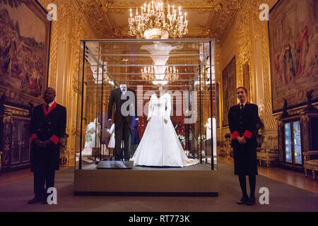 Windsor, UK. 28th Feb, 2019. HRH Princess Eugenie's wedding dress, created by Peter Pilotto and Christopher De Vos of the British-based label Peter Pilotto, and Mr Jack Brooksbank’s morning suit made by tailors at Huntsman on Savile Row, which go on display with other items from their wedding outfits at Windsor Castle  from 1st March to 22nd April. Other items  include the Greville Emerald Kokoshnik Tiara and two diamond wheat-ear brooches. Credit: Mark Kerrison/Alamy Live News Stock Photo