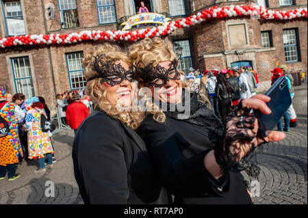 Dusseldorf, Germany. 28th Feb 2019. Two women are seen posing for a selfie while wearing costumes during the celebration. On the first day of the carnival or Altweiberfastnacht, the women (called Möhnen) storm the City Council Offices to capture the Lord Mayor and take over the administration of the City for the night and that is the official opening of the street carnival in the old city of Düsseldorf. Credit: SOPA Images Limited/17�Թ����� Live News Stock Photo