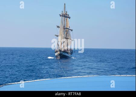 Key West, Florida, USA. 28th February, 2019. The sail training ship Pelican of London is towed by the U.S. Coast Guard Cutter Charles David Jr. after suffering an engine failure 49 miles northeast of Cuba February 28, 2019 near Key West, Florida. The 149-foot tall sail vessel with 42 passengers aboard was towed without incident to port for repairs. Credit: Planetpix/Alamy Live News Stock Photo