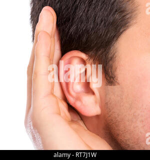 Hand on ear listening for quiet sound Stock Photo