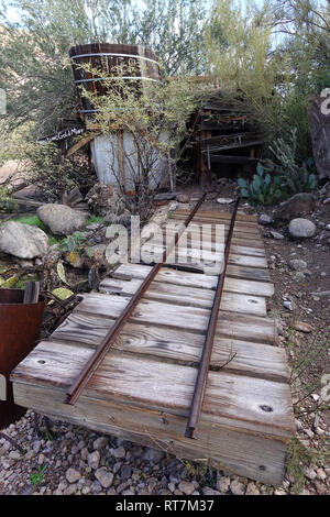 Underneath the mountains and deserts of the U.S. West lie hundreds of thousands of abandoned mines, here rail tracks lead into a mine. Stock Photo