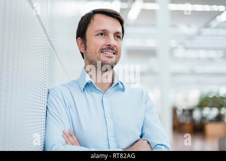 Portrait of a confident businessman, with arms crossed Stock Photo