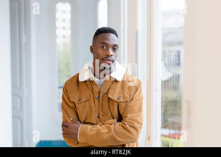 Portrait of young man with shaved head and beard Stock Photo