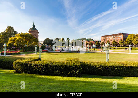 Germany, Mannheim, Friedrichsplatz with fountain and water tower in the background Stock Photo