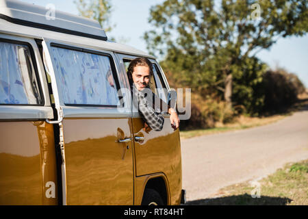 Young man on a road trip with his camper Stock Photo