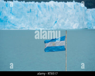 Argentina, Patagonia, El Calafate, Argentinian Flag with Glacier Perito Moreno in the background Stock Photo