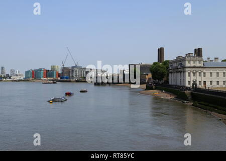 Various buildings (including part of the Old Royal Naval College and the Optic Cloak) along the River Thames, in Greenwich, London, United Kingdom. Stock Photo