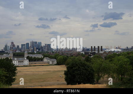 View over the city and architectural landmarks like the Old Royal Naval College and the O2 Arena from Greenwich in London, United Kingdom. Stock Photo