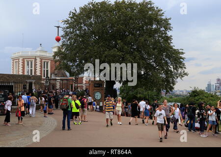 Tourists outside the historical Flamsteed House (designed by Christopher Wren), a museum at the Royal Observatory Greenwich in London, United Kingdom. Stock Photo