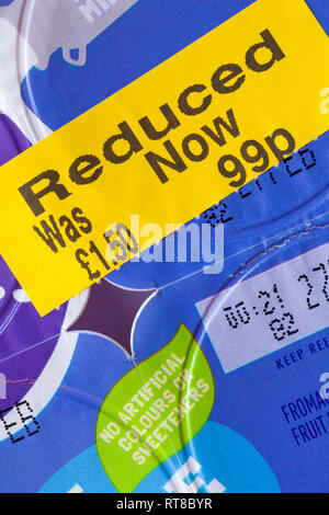 Yellow reduced sticker on multipack of Yoplait Petits Filous yogurts - no artificial colours or sweeteners - was £1.50 now 99p Stock Photo