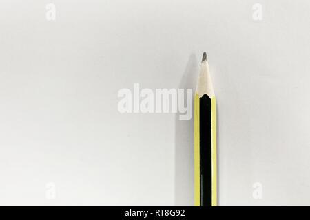 pencil on plain white paper. background for idea formulation and writing concepts. Stock Photo