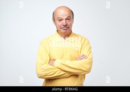 Miserable sad mature european man being offended and upset, expressing sadness and negative emotions Stock Photo