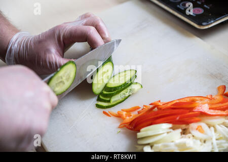 Chef chopping carrot sticks into a small dice, closeup shot. Man performing  good knife skills during cooking a meal Stock Photo - Alamy