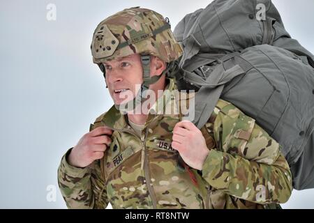 The commander of 4th Battalion, 319th Field Artillery Regiment, 173rd Airborne Brigade, U.S. Army Lt. Col James H.B. Peay walks off the drop zone after a training jump with multinational partners from United Kingdom, Germany and Spain at the 7th Army Training Command's Grafenwoehr Training Area, Germany, Jan. 29, 2019. Stock Photo