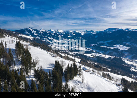 Beautiful aerial drone panorama of mountain valley, cottages and villages in cold winter day. Stock Photo