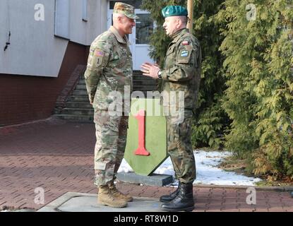 Col. Patrick Michaelis, commander of the Mission Command Element in Poznan, Poland, greets Major General Jaroslaw Gromadzinski, Commander of the 18th Mechanized Division, at the MCE Jan. 31.    The purpose of the visit was to gain an understanding of the MCE's command post daily operations.    U.S. forces deployed to Europe in support of Atlantic Resolve is evidence of the strong and unremitting U.S. commitment to NATO and Europe. Through continuous, multinational training and security cooperation activities, Atlantic Resolve builds readiness, increases interoperability and enhances the bond b Stock Photo