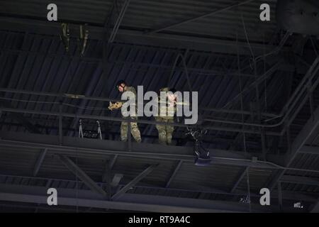 Instructors from The Sabalauski Air Assault School prepare themselves prior to conducting rappelling demonstrations at Middle Tennessee State University in Murfreesboro, Tenn. Jan. 30. Stock Photo