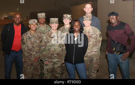 U.S. Army Soldiers assigned to the 335th Signal Command (Theater) (Provisional) pose following the Arifjan Idol Finals, Camp Arifjan, Kuwait, January 26, 2019. Pictured from left to right: Sgt. 1st Class Anthony Bruce, 1st Lt. Nisha Chawla, 1st Sgt. Shéshé Lang, Brig. Gen. Nikki Griffin Olive, 1st Lt. Caroline Shaw, Sgt. 1st Class Carmen Granville, Capt. Jennifer Dennis, Sgt. 1st Class David Moseley, and Master Sgt. James Geter. Stock Photo