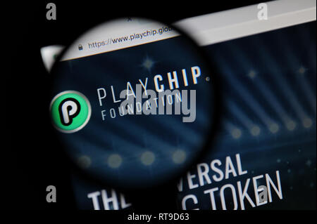 The PlayChip website seen through a magnifying glass Stock Photo