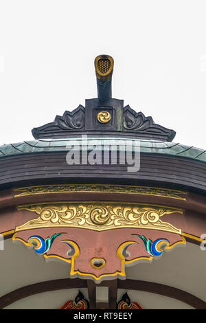 Setagaya, Tokyo, Japan - August 19, 2017: Haiden (worship hall) of Kitazawa Hachiman Jinja. Roof Toribusuma and Kazari-Kanagu (Metal ornaments) detail Stock Photo