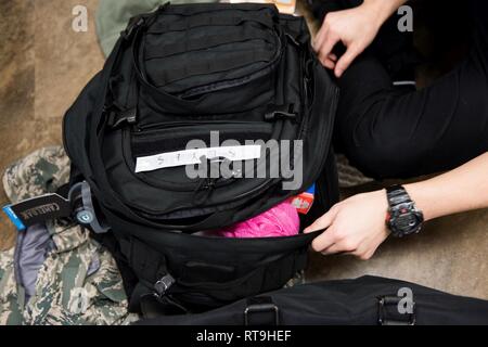 U.S. Air Force basic training trainees inventory items in their issued backpack Jan. 29 2019 at Joint Base San Antonio Lackland Texas. The Backpack Initiative provides immediate gear normally purchase...