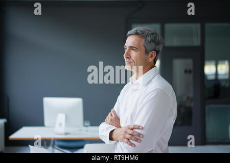 Businessman in the office thinking Stock Photo