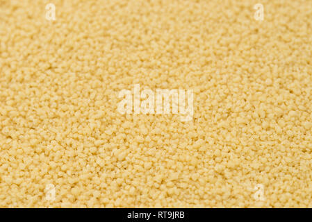 couscous raw grains macro  background selective focus couscous Stock Photo