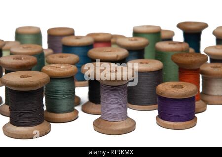 wooden coils with colorful threads of pastel colors Stock Photo