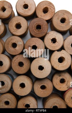 wooden coils with colorful threads of pastel colors Stock Photo