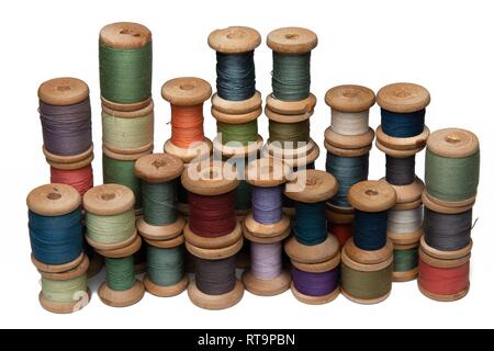 wooden coils with colorful threads of pastel colors Stock Photo