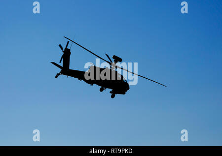 apache military attack helicopter in flight Stock Photo