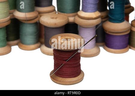 wooden coils with colorful threads of pastel colors Stock Photo