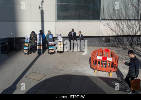 A group of Jehovah's Witnesses stand with their literature stands at Elephant & Castle, on 27th February 2019, in London, England. Stock Photo