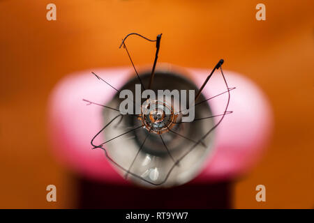 Abstract picture of filament in broken light bulb seen from top Stock Photo