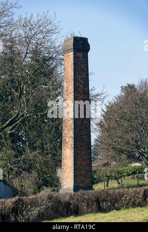 Old Industrial Chimney Stack in Field  Ganders Green, below May Hill, Gloucestershire, UK Stock Photo