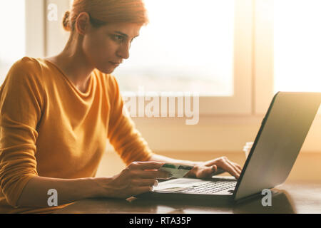 Young woman doing online shopping Stock Photo
