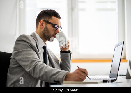 Young businessman is working in office. Stock Photo
